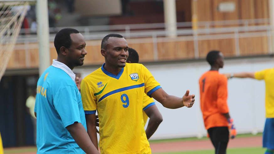 Forward Jacques Tuyisenge, seen here chatting with head coach Vincent Mashami during a past training session, was Amavubiu2019s stand-in captain against Ivory Coast on Saturday.  File.