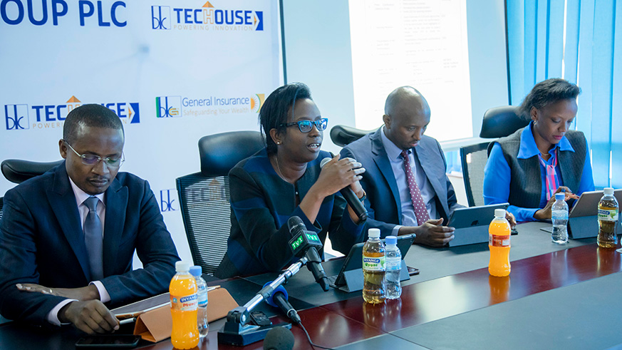 BK Group chief executive Diane Karusisi (2nd left) addresses the media yesterday. She was flanked by Alex N. Bahizi, the CEO of BK General Insurance (left); Vincent Gatete, the Chief Commercial Officer (2nd right);  and Nathalie Mpaka, the Chief Finance Officer (right). The Group posted a net profit of Rwf27 billion in 2018. Emmanuel Kwizera.