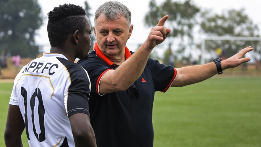 APR Forward Muhadjiri Hakizimana, seen here taking instructions from head coach Zlatko Krmpotiu0107 in a past game, scored the opening goal against Mukura at Huye Stadium on Wednesday. Julius Ntare.