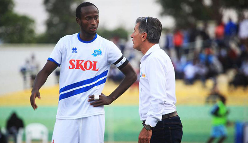 Skipper Thierry Manzi chats with Rayon Sports' Brazilian head coach Roberto Oliveira during a past league match against Police at Kigali Stadium. File.