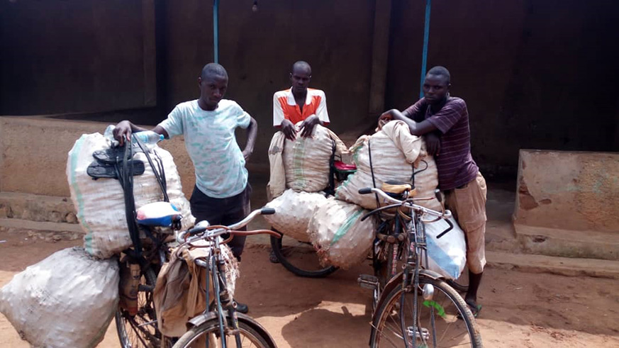 The three Ugandans intercepted in Rwanda after they illegally entered the country their merchandise. They say they are short of market back home. Courtesy 