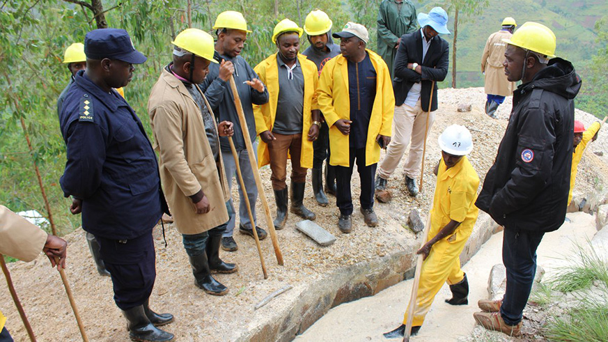 Francis Gatare, the chief executive of Rwanda Mines, Petroleum and Gas Board (3rd from left) with officials during a visit of a mining cooperative in Gakenke District. Michel Nkurunziza.