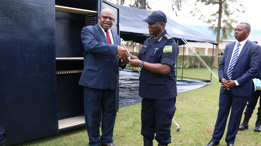 RECSA Executive Secretary Lt. Gen. Badreldin Elamin Abdelgadir handing over keys to DIGP Juvenal Marizamunda to handover the arms storage facilities. Courtesy.