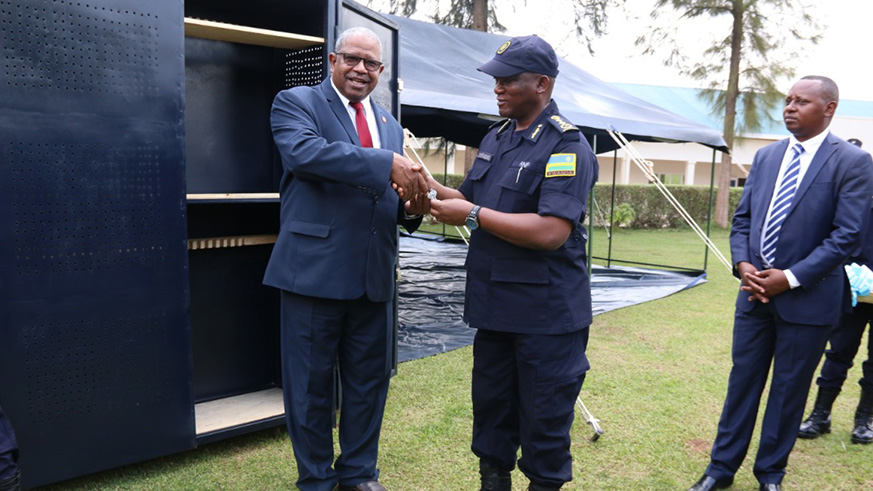 RECSA Executive Secretary Lt. Gen. Badreldin Elamin Abdelgadir handing over keys to DIGP Juvenal Marizamunda to handover the arms storage facilities. Courtesy.