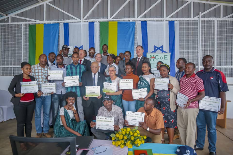 Trainees and trainers pose for a photo after receiving certificates, together with officials, at the launch of the Rwanda-Israel Horticulture Centre of Excellence. 