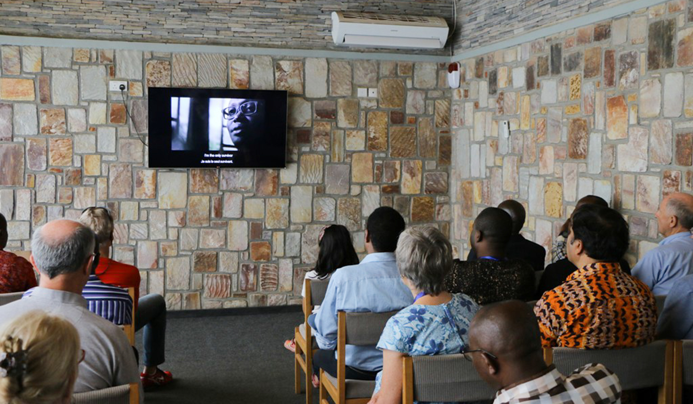 Visitors watch a movie at Kigali Genocide Memorial Centre, in Gisozi depicting the impact of the Genocide. Emmanuel Kwizera.