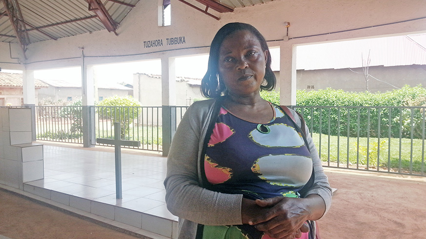 Rose Burizihiza, at Mukura Genocide Memorial in Huye District. Most of her loved ones  are buried at the same memorial site. Photos by Anne Dushimimana