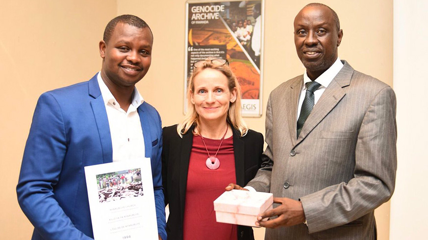 Swedish journalist,Gunilla von Hall, hands over the 112 unpublished photos to representative of AEGIS Trust (Freddy Mutanguha, left) and CNLG (Jean Ruzindaza, right) on Wednesday.