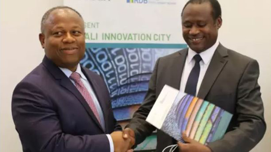 Africa50 CEO, Alain Ebobissu00e9 and Minister of Finance Dr. Uzziel Ndagijimana (right) shake hands after signing an agreement to co-sponsor and partner for the development and funding of the Kigali Innovation City. Courtesy .
