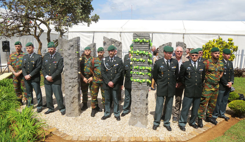 Belgian officers pose near a 10-stone monument erected to honour the 10 Belgian peacekeepers who were killed in Kigali in 1994. Sam Ngendahimana.