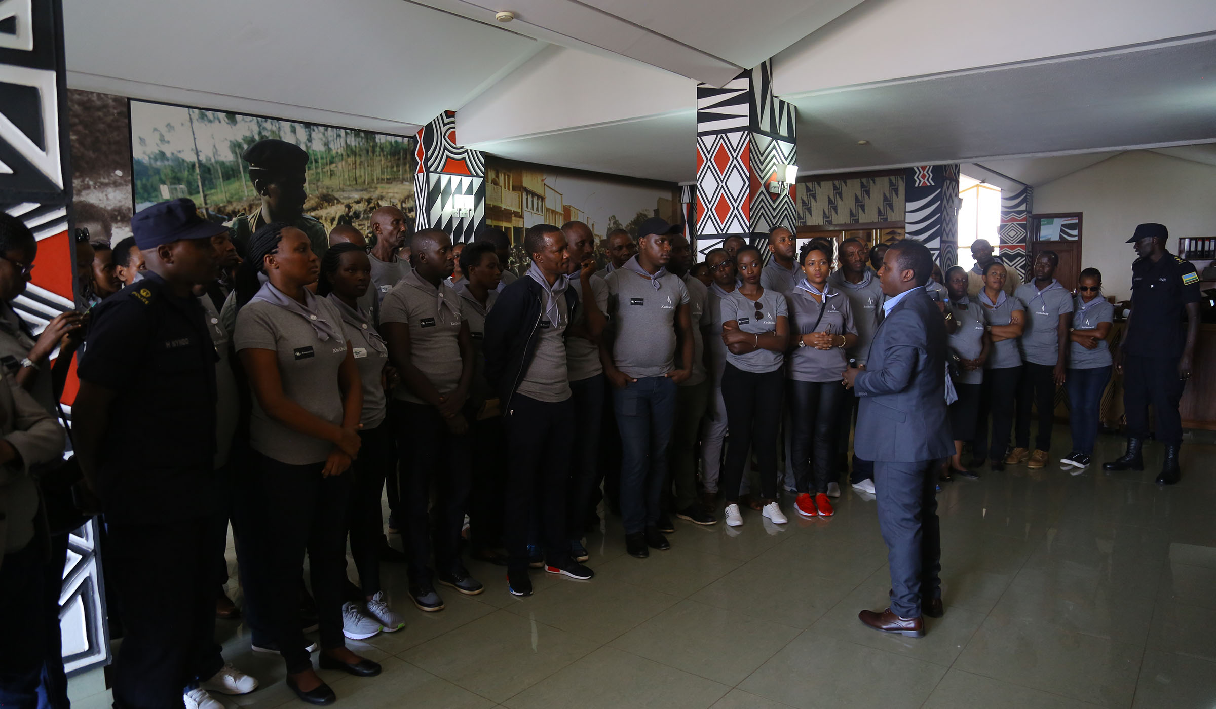 Members of the aviation community listen to a guide inside the Campaign against Genocide Museum at Parliamentary Buildings on April 10, 2019. Samuel Ngendahimana.