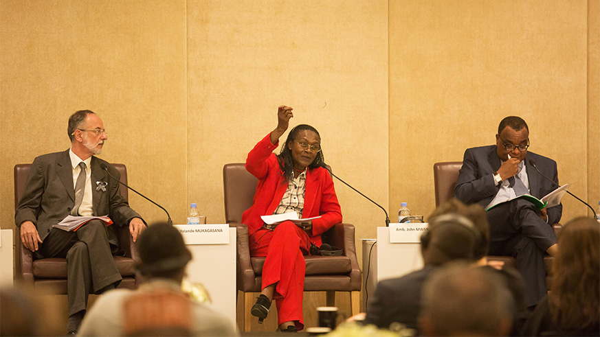 Yolande Mukagasana, an author, historian and researcher of the 1994 Genocide against the Tutsi (cetre), speaks on a panel during a session of reflection for members of the diplomatic corps accredited to Rwanda at Kigali Marriott Hotel yesterday. Looking on are Belgian Ambassador Benou00eet Ryelandt (left) and Kenyan envoy John Mwangemi. Nadege Imbabazi.