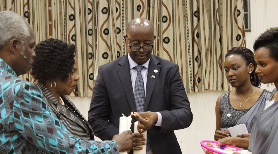 Rwandan High Commissioner to Zimbabwe James Musoni is joined by Zimbabwean information minister Monica Mutsvangwa and the DR Congo envoy to Zimbabwe, Mwana Nanga in lighting candles of hope during the commemoration event in Harare. / Courtesy