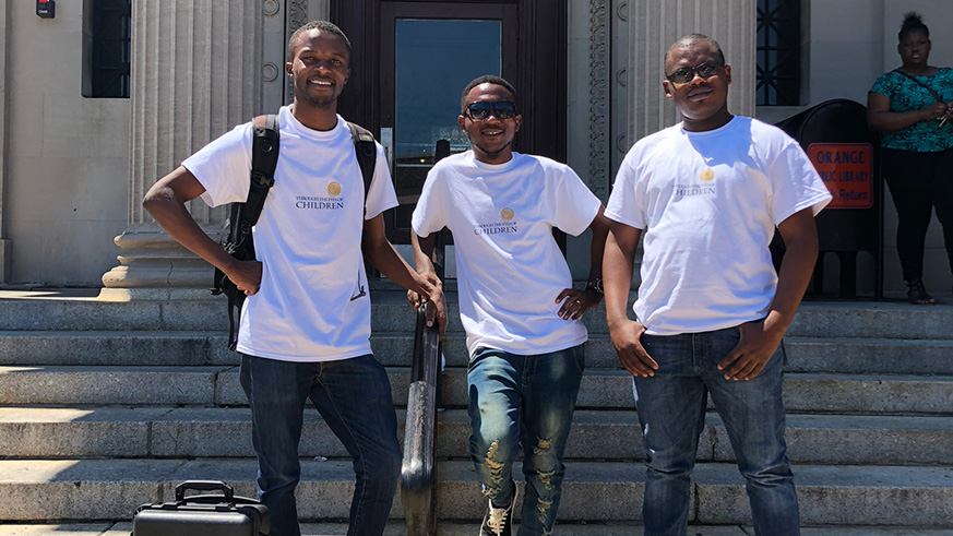 Jean Bizimana, Gadi Habumugisha and Mussa Uwitonze are using their photography skills to help vulnerable young people  express themselves. Courtesy photos.