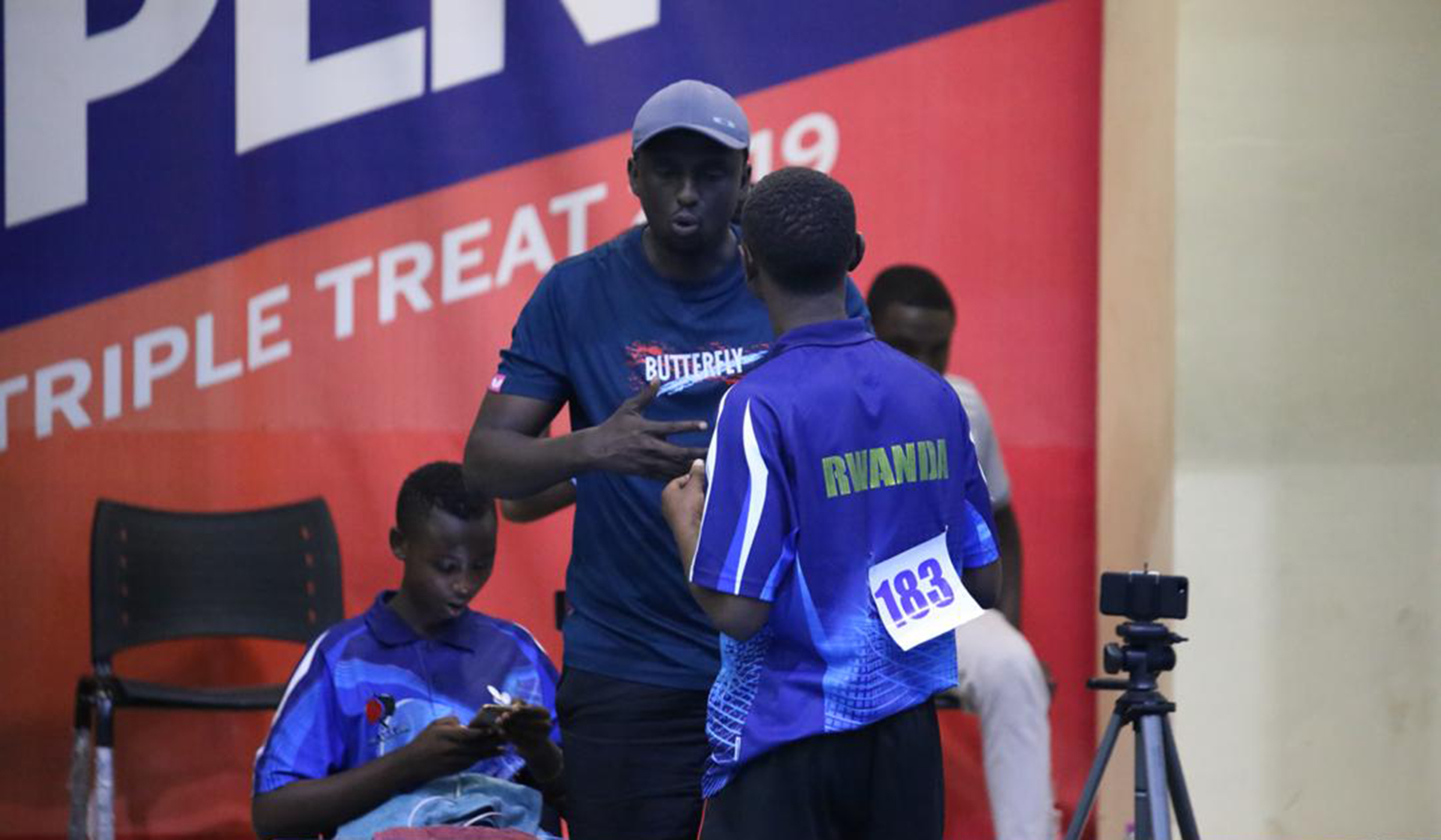 Coach Yves Ndizeye talks to his players during the Games in Accra. Courtesy.