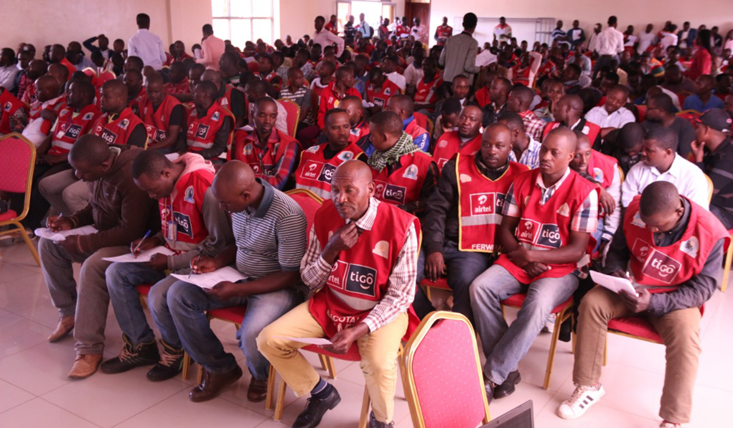 Moto-taxi operators take notes during the meeting in Kimironko, Gasabo District yesterday. A. Major.