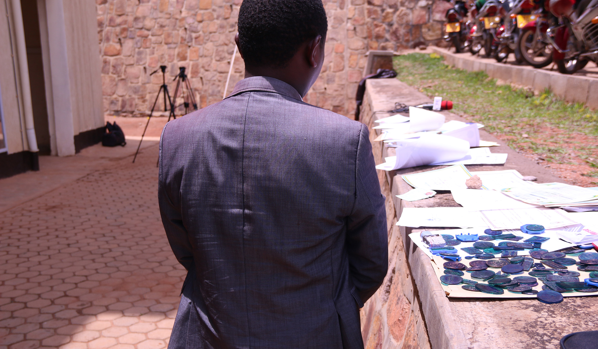 The suspect and several forged stamps. Courtesy.