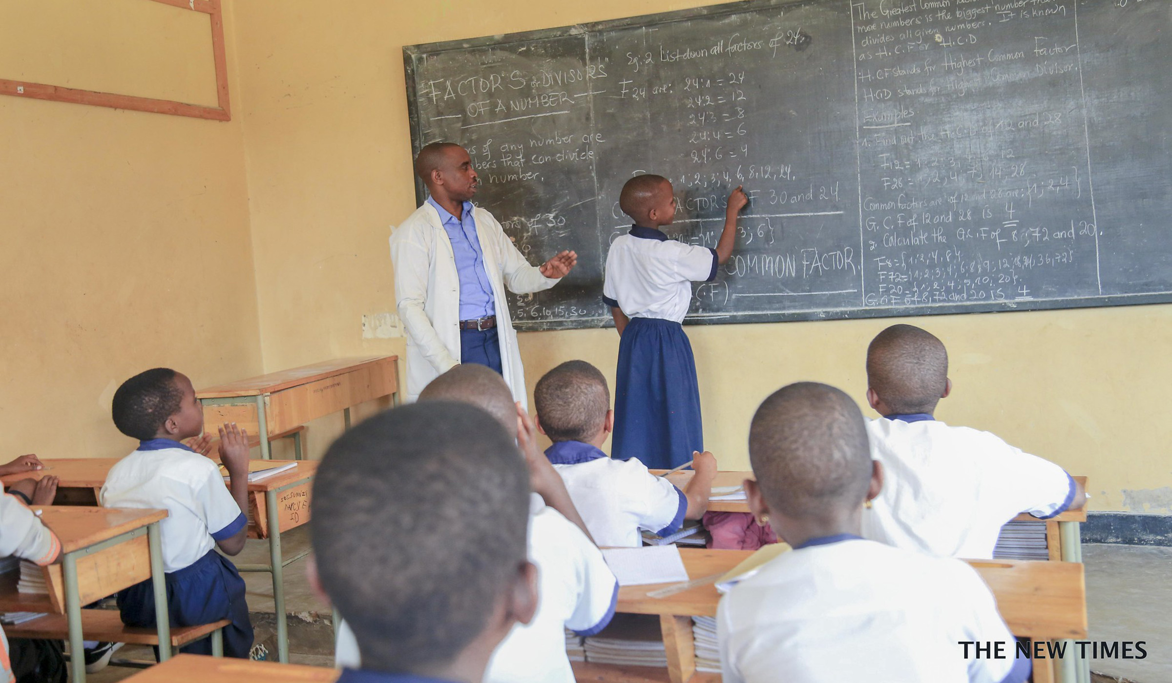 Teacher at blackboard explains children mathematics in Kigali. Emmanuel Kwizera