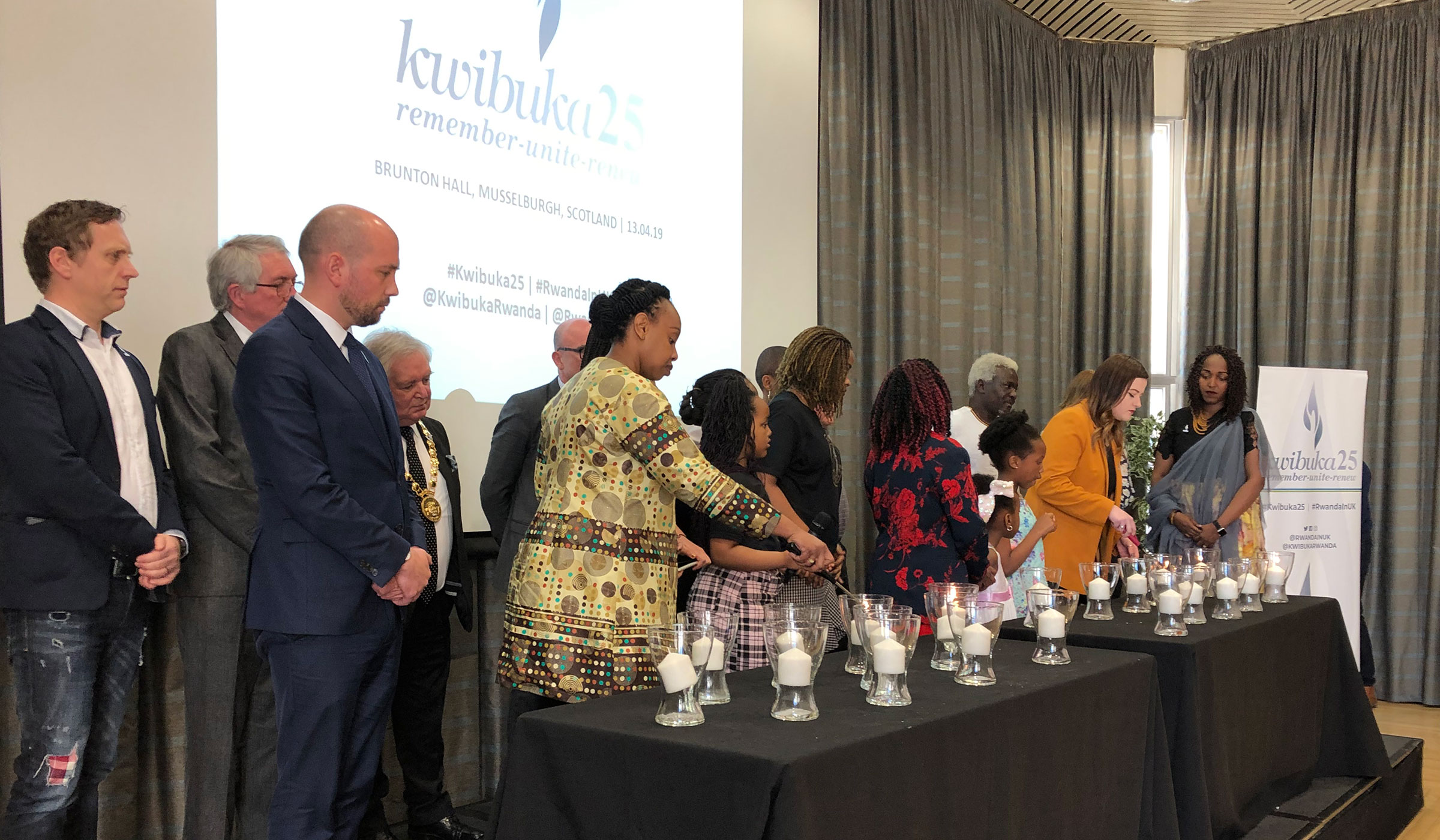 The High Commissioner leads the candle lighting at Kwibuka25 in Scotland