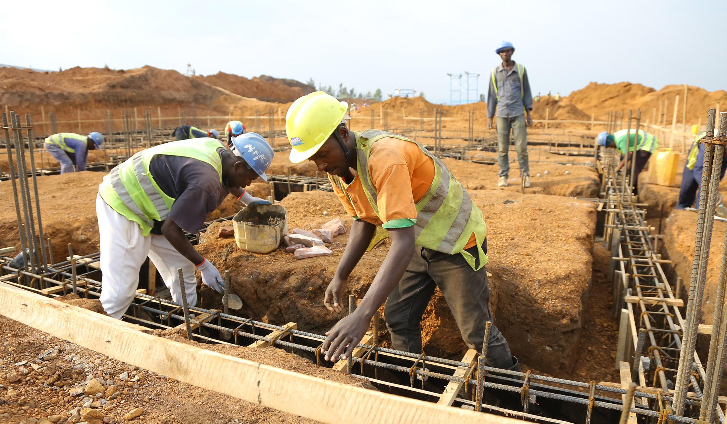 Workers during construction activities in Busanza. Sam Ngendahimana.