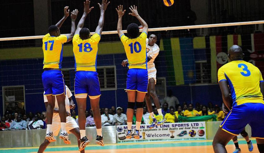 National volleyball team players try to block a spike from a Kenyan player during the final game of the just-concluded Zone V at Amahoro indoor stadium. File.