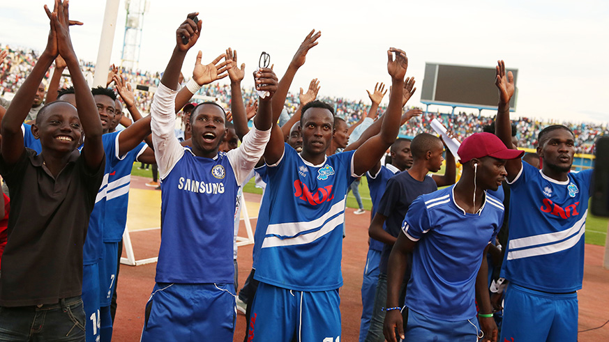 Rayon Sports players and fans celebrate their hard-fought victory after beating APR 1-0 at Amahoro Stadium on Saturday.  Sam Ngendahimana.