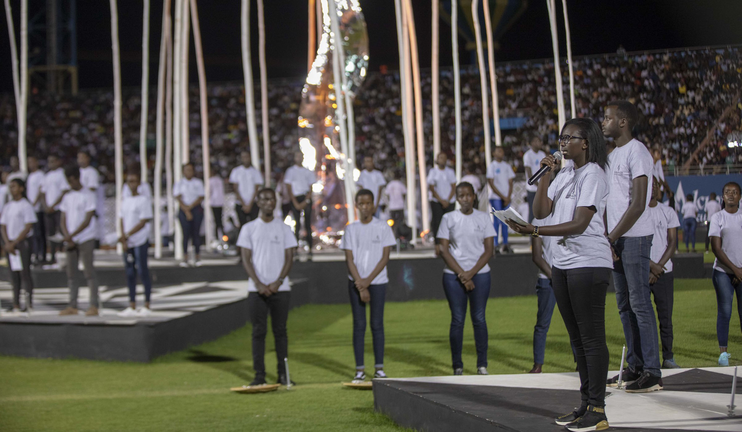 Young people recite some of the names of the victims of the 1994 Genocide against the Tutsi at Amahoro National Stadium on April 7, 2019. E. Kwizera.
