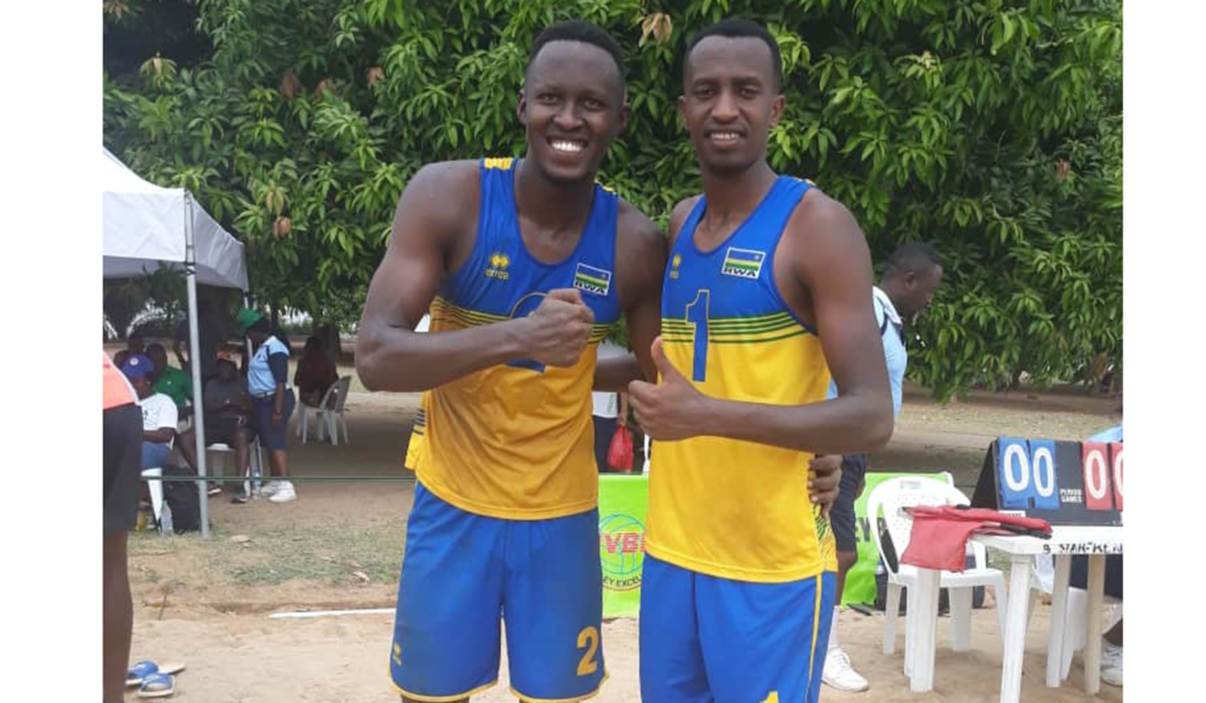 Patrick Kavalo Akumuntu (L) and Olivier Ntagengwa celebrate after coming from a set down to beat Egypt on Tuesday. Courtesy.