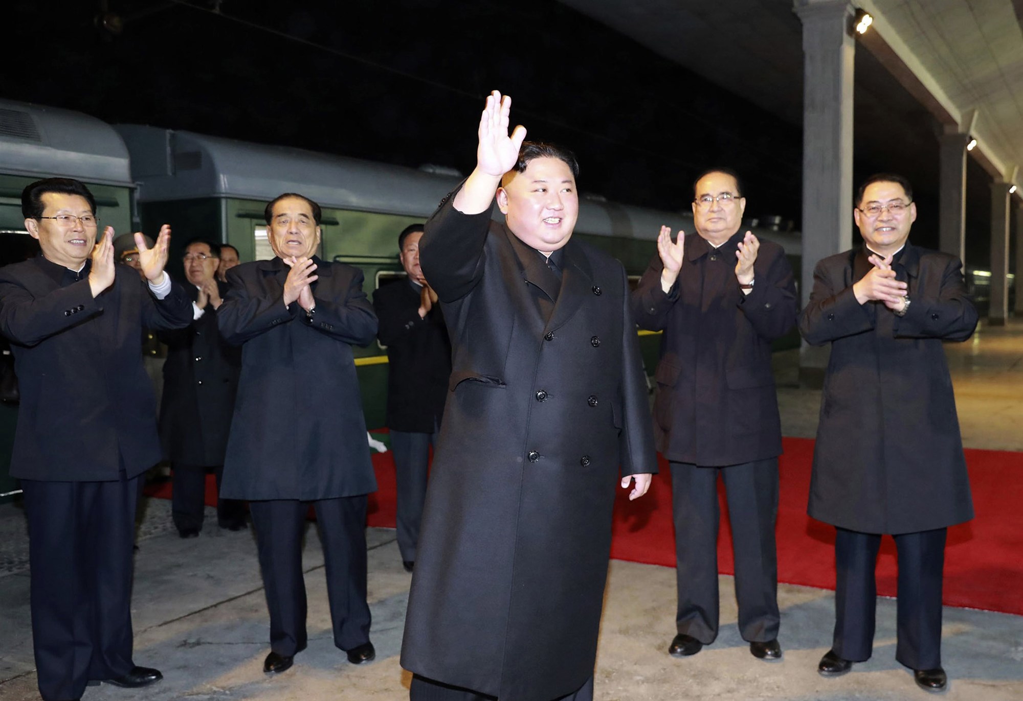 In this photo provided by the North Korean government, North Korean leader Kim Jong Un waves at an undisclosed train station in North Korea on April 24, 2019, before leaving for Russia. / KCNA / Korea News Service via AP