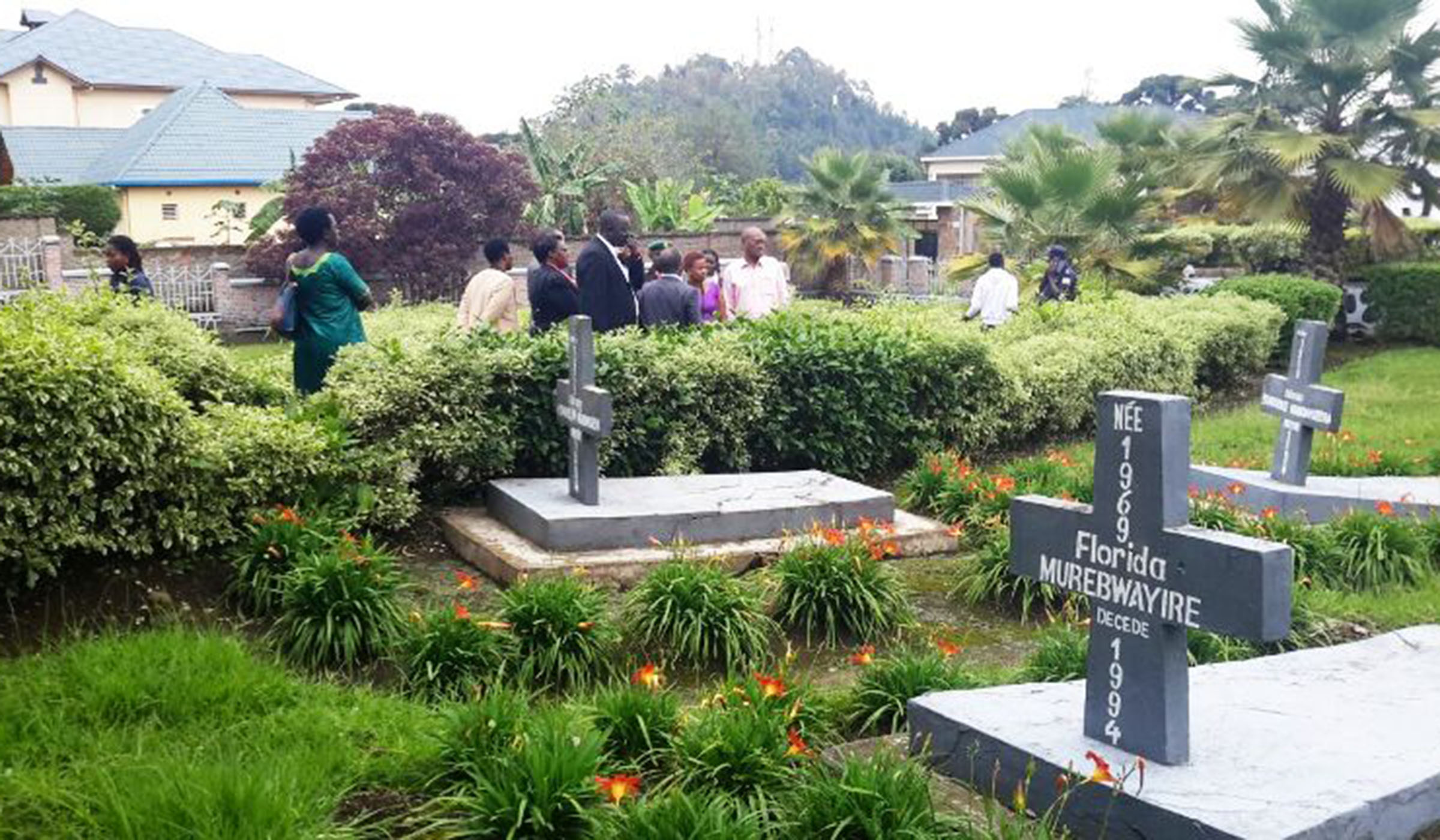 Mourners during a commemoration event at Muhoza Genocide Memorial. Survivors want it renovated as water from roads flows into the graves. Ru00e9gis Umurengezi.