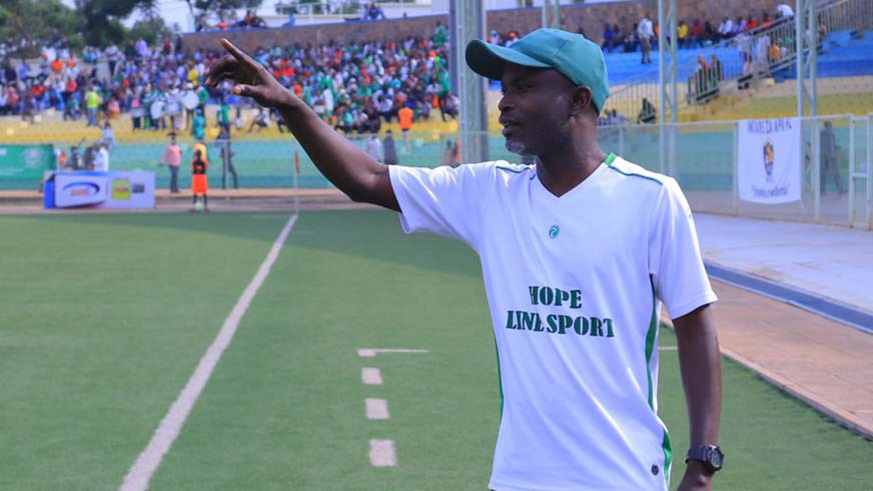 SC Kiyovu head coach Alain Kirasa gives instructions to his players during a past league match against APR at Kigali Stadium. File.