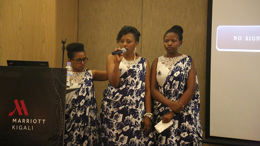 Ange Umuraganyurwa (centre) narrates her ordeal last week as employees of Kigali Marriott Hotel paid tribute to victims of the 1994 Genocide against the Tutsi. Courtesy.