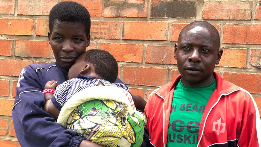 Dusabimana and her husband and child during the interview in Kigali. Courtesy.