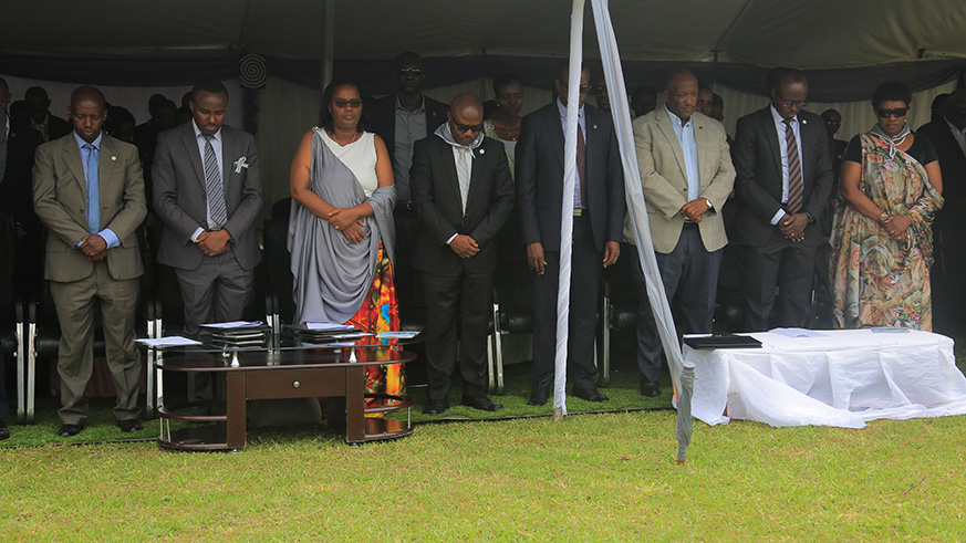 Mourners at the commemoration event observe a minute of silence to remember  the victims of the Genocide against the Tutsi. Hudson Kuteesa.
