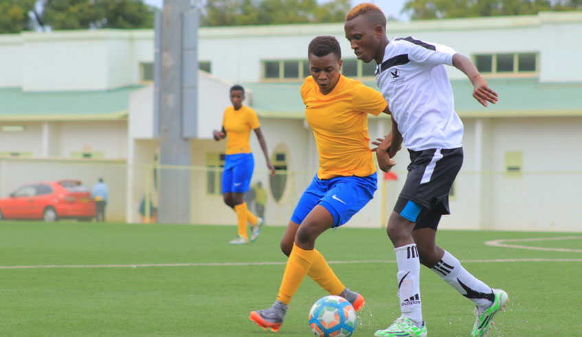Scandinavia striker Jeannette Ukwinkunda (with the ball) takes on As Kigali defender Joselyne Mukantaganira during a past match. File.