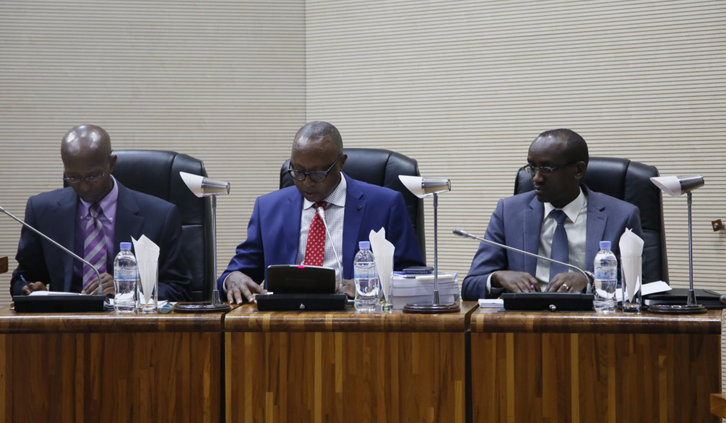 Auditor-General Obadiah Biraro, flanked by his deputy Patrick Habimana (right), presents the 2017/18 annual report to a joint session of the Lower House and Senate at the Parliamentary Buildings in Kimihurura on April 29. Left is Deputy Speaker in charge of Finance and Administration Sheikh Musa Fazil Harelimana. Biraro said there were fears that public funds amounting to over Rwf5.6 billion were either wasted or swindled in the 2017/18 fiscal year. Courtesy.
