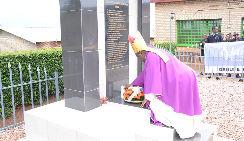 Catholic Church archbishop, Antoine Kambanda, laying wreath on the Genocide monument at G.S Kabare secondary school, which some 25 students and staff were thus far identified victims.