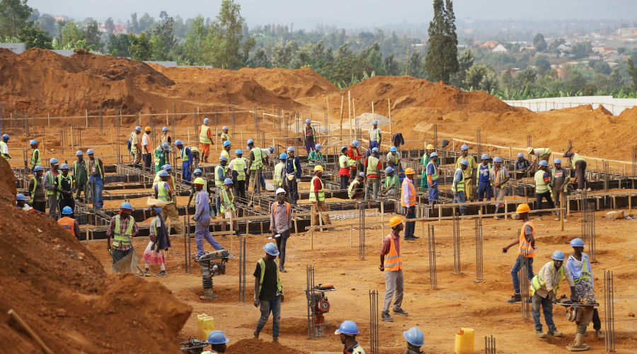 Workers at a construction site in Busanza, Kicukiro District. / Sam Ngendahimana