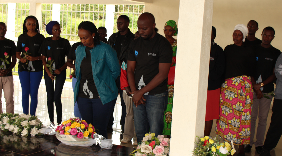 BBOXX staff honor victims of the 1994 Genocide against the Tutsi at Nyanza Genocide Memorial  First raw L-R, Claudine Uwagaga (HR Manager) and John Uwizeye (Head of Retail Operations).