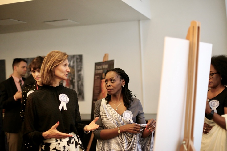 State Secretary in the Norwegian Ministry of Foreign Affairs Ms. Marianne Hagen and Ambassador Christine Nkulikiyinka inspect an exhibition on the 1994 genocide against the Tutsi. Courtesy