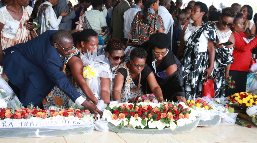 Family members lay wreaths as over 83,000 victims of the Genocide against the Tutsi were accorded a decent burial at Nyanza Genocide memorial on Saturday. / All photos by Sam Ngendahimana
