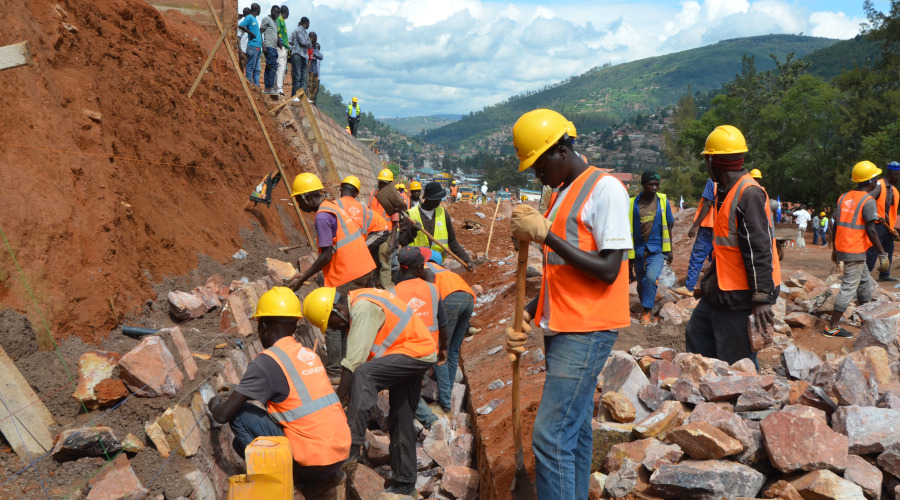 Workers during construction of the Nyabugogo road last year. City of Kigali wants more money to expand roads ahead of CHOGM meeting next year. / Sam Ngendahimana