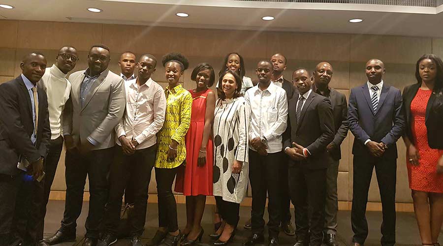 Rwandans who benefited from previous TEF editions pose for a group photo in Kigali after meeting Tony Elumelu. / Courtesy