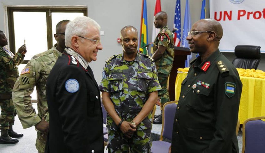 Col Jill Rutaremara (right) chats with some participants at Rwanda Peace Academy. Ru00e9gis Umurengezi.