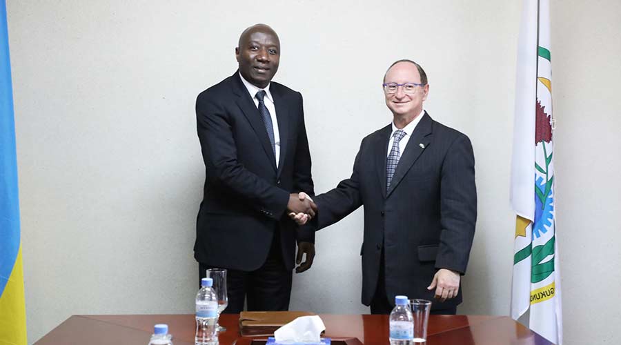 Ngirente shakes hands with Amb. Adam. / Courtesy