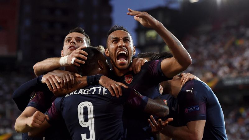 Pierre-Emerick Aubameyang celebrates with teammates after scoring Arsenal's first goal during the UEFA Europa League Semi Final Second Leg match against Valencia at Estadio Mestalla on Thursday. / Net