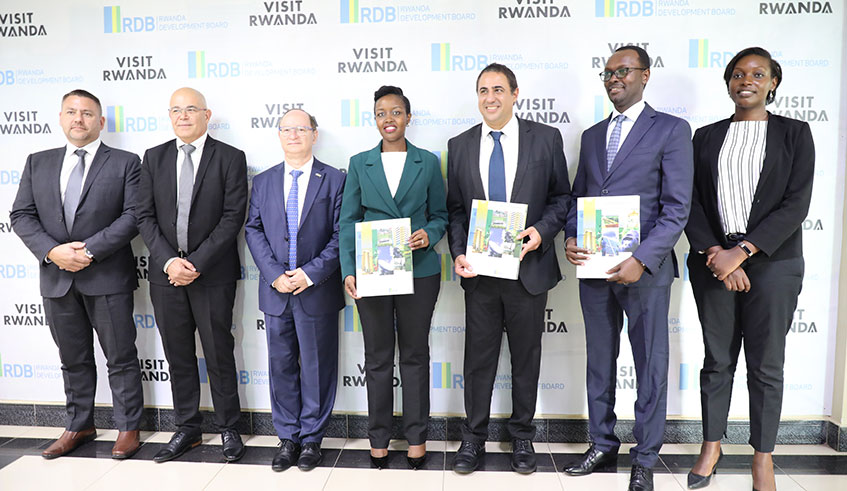 Representatives from  Motorola and Rwanda  government officials pose for a group photo after the  signing ceremony.  Courtesy.