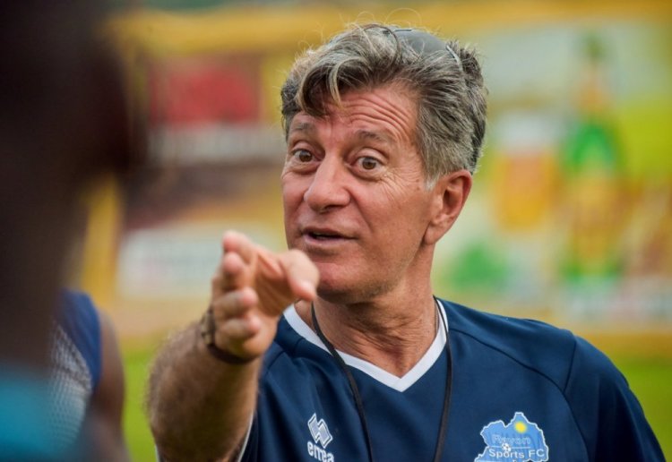 Captain Vincent Kompany lifts the Premier League trophy as he and teammates celebrate Manchester City's back-to-back win of the silverware, having beaten Liverpool to the highly coveted crown by a solitary point on the final day of the season on Sunday. Net