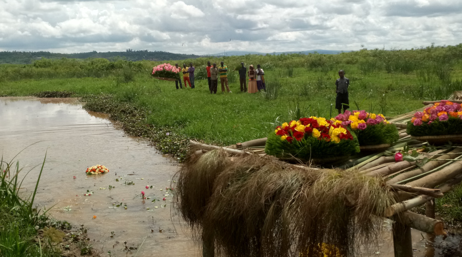 Mourners lays wreaths in the swamp where their family members perished during the Genocide against the Tutsi. / Jean du2019Amour Mbonyinshuti