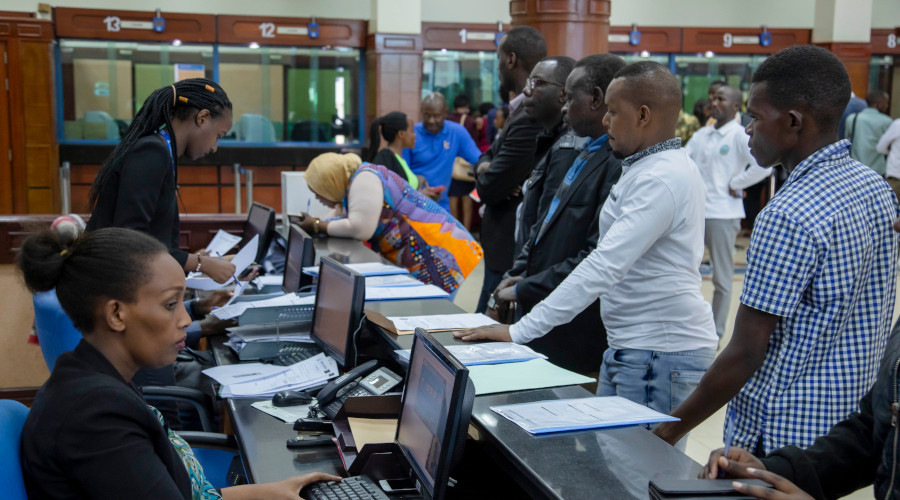 Clients being served in the banking hall of a local commercial bank. Both the central bank and commercial banks have raised concern over the cumbersome process to auction collateral from loan defaulters, with some saying it is one of the factors that keep loans very expensive. / Emmanuel Kwizera